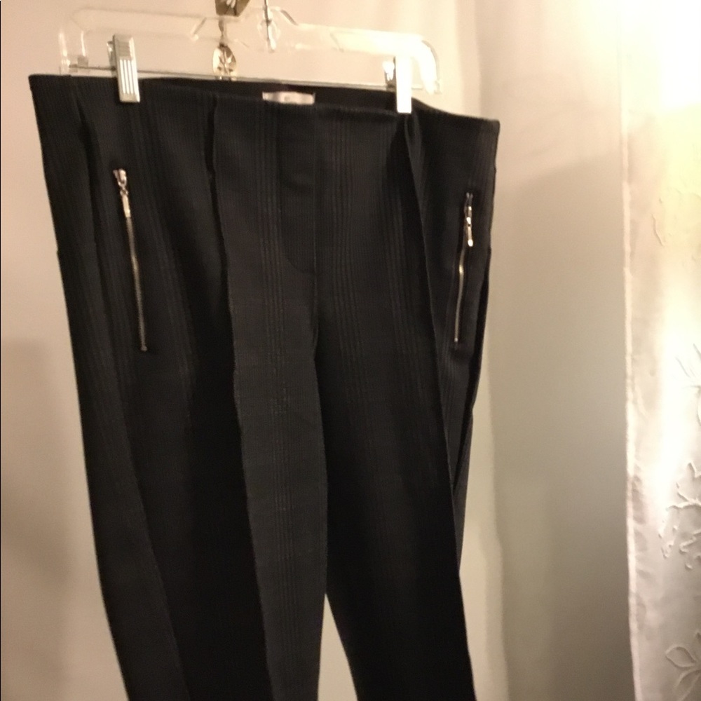 Pull on pleated slacks with zippered accents